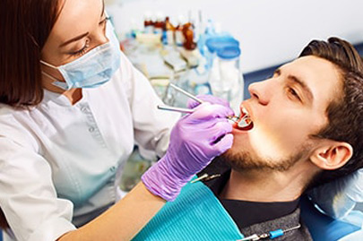 Man at the dentist's chair during a dental procedure