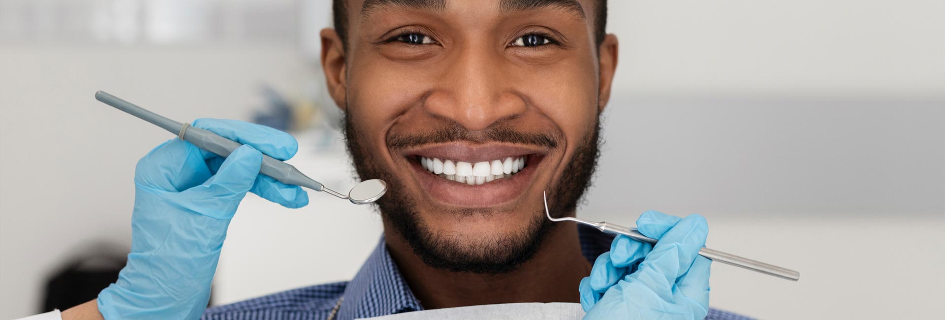 A young man smiling at the dentist